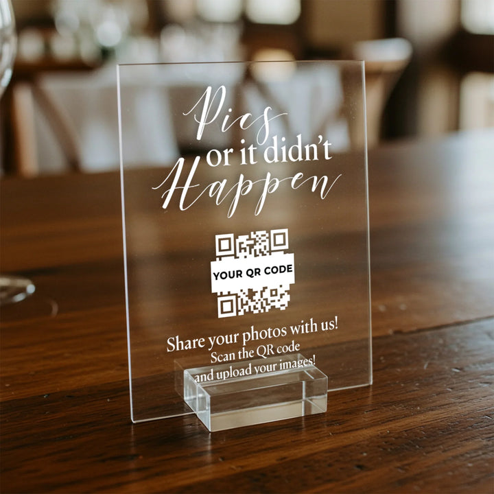 Acrylic wedding table sign with white text 'Pics or it didn't happen' and a QR code for photo sharing