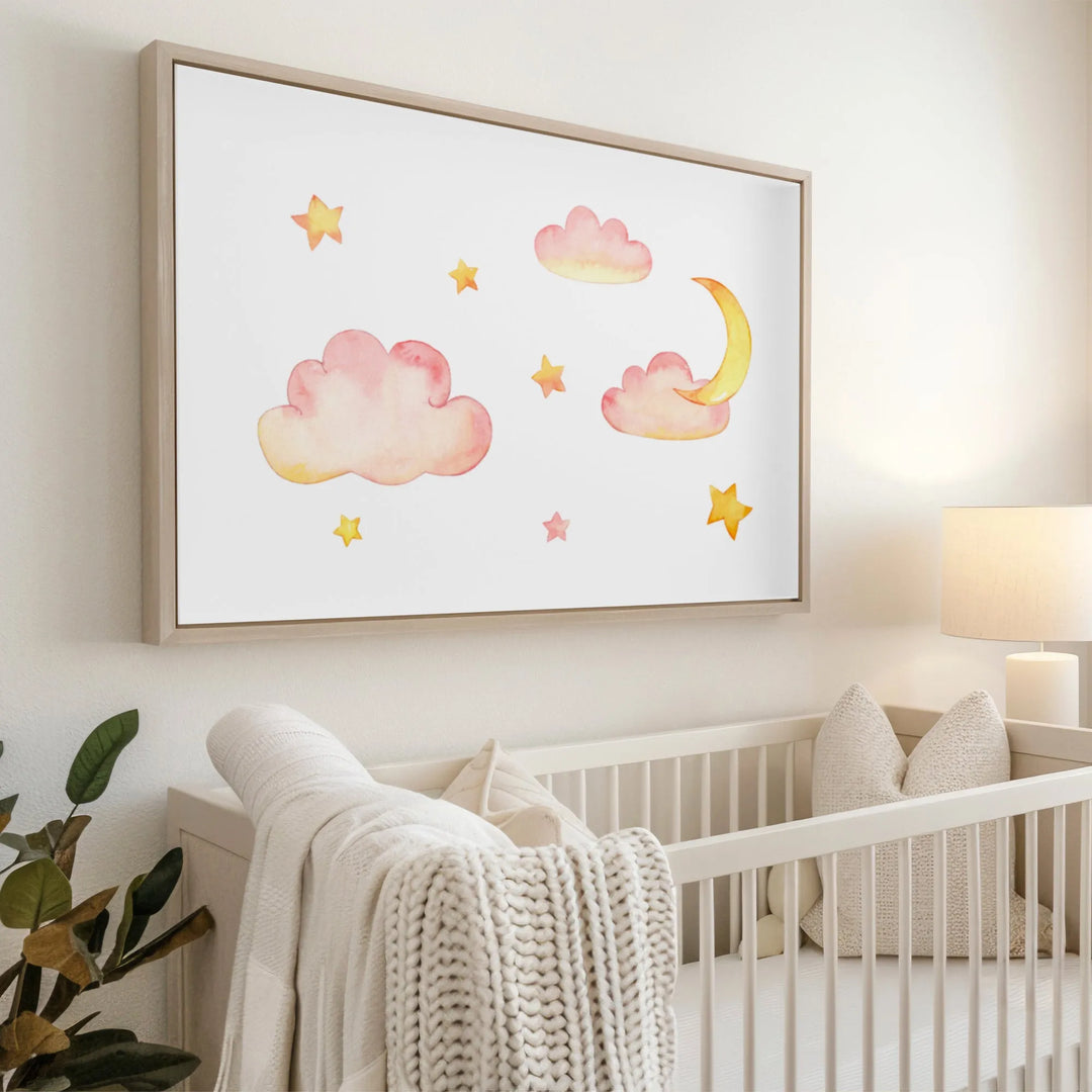 Watercolor nursery wall art with pink clouds, yellow stars, and crescent moon above white crib