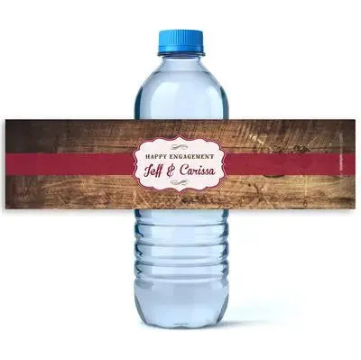 Rustic wood maroon engagement water bottle label with personalized names on a water bottle.
