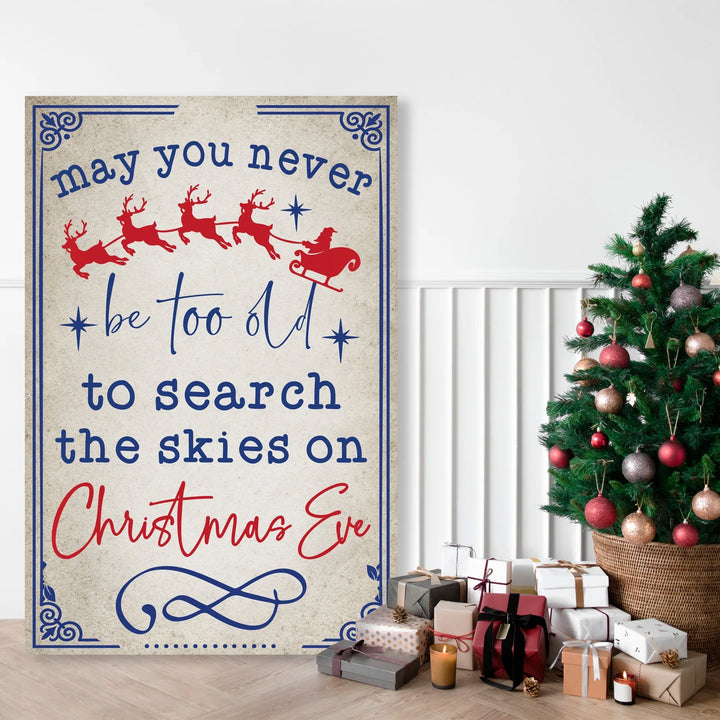 Christmas metal sign with Santa sleigh and reindeer, greeting text by decorated Christmas tree and gifts