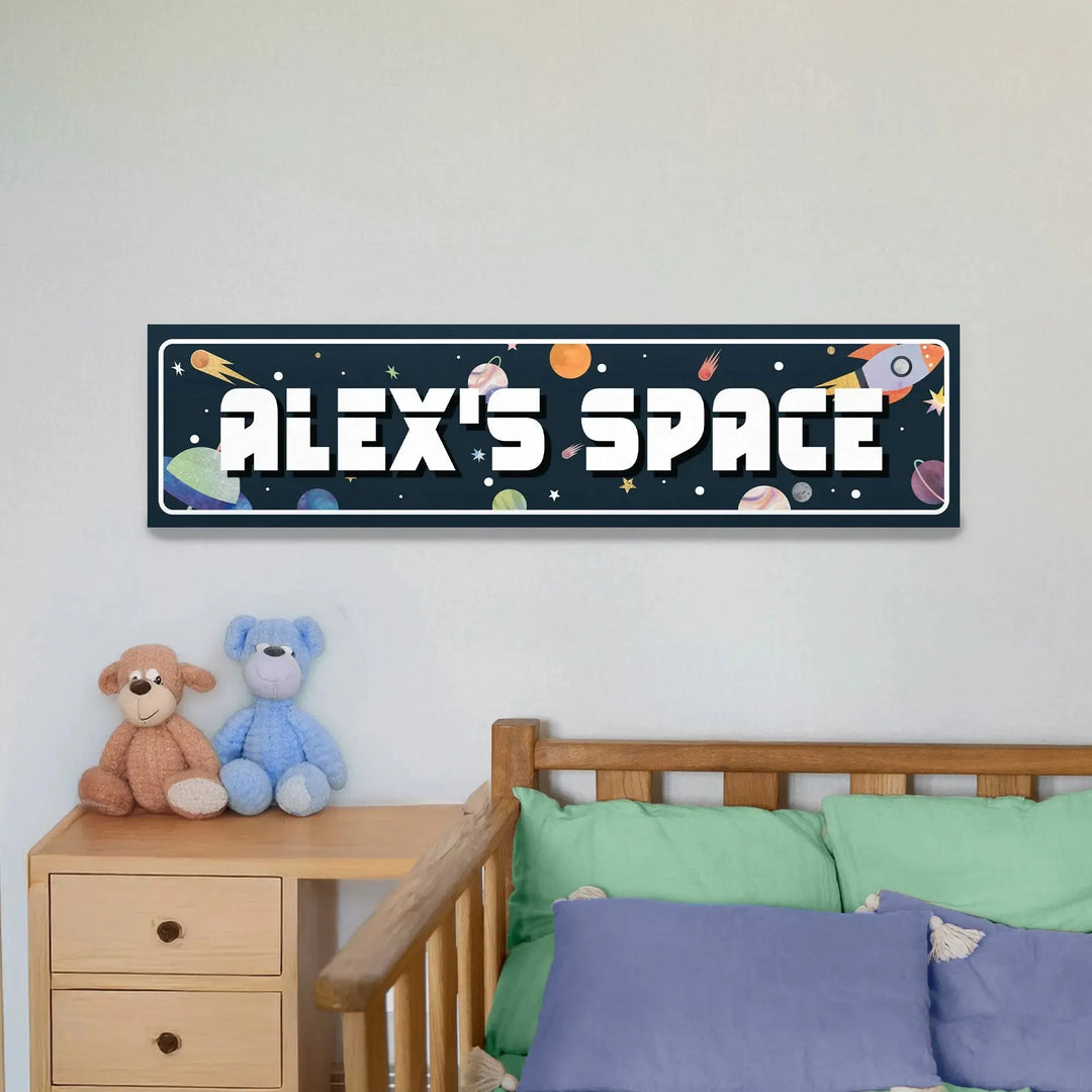 Personalized space-themed metal sign reading 'Alex's Space' with planets and rocket above wooden bed