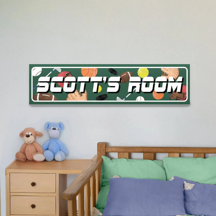 Green sports-themed metal sign with "SCOTT'S ROOM" above bed with blue and green pillows and two stuffed animals
