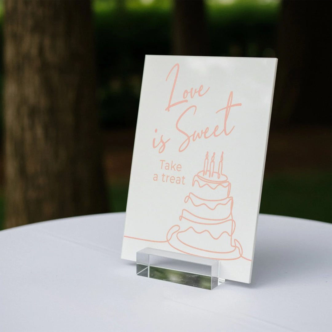 Wedding dessert table sign reading Love is Sweet Take a treat with cake illustration