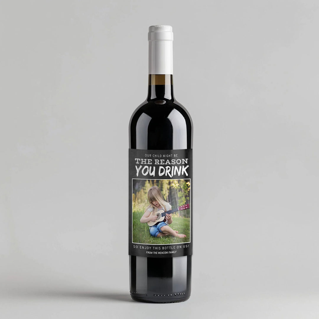 Wine bottle with funny teacher appreciation label and photo of child playing ukulele on grass.