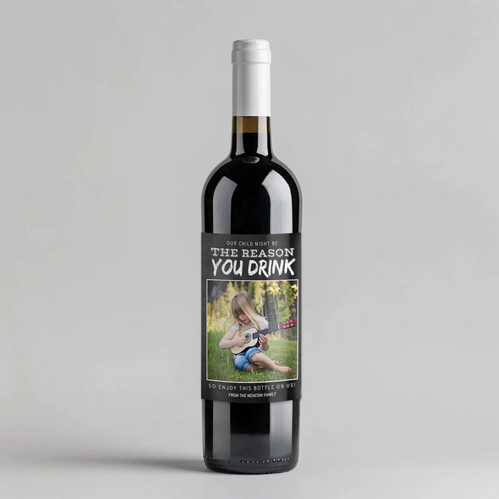 Wine bottle with funny teacher appreciation label and photo of child playing ukulele on grass.