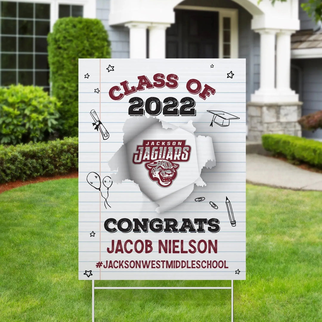 Graduation yard sign on lawn, Class of 2022, congrats Jacob Nielson, Jackson Jaguars logo, school celebration