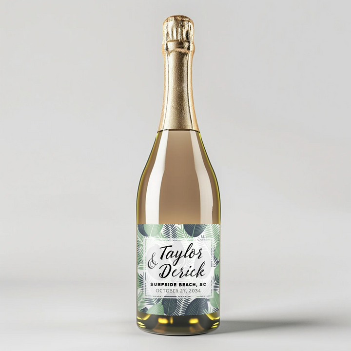 Champagne bottle with tropical leaves label, personalized for a wedding celebration