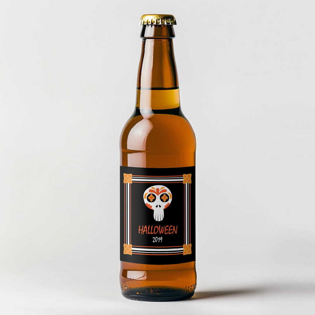 Amber beer bottle with a Halloween skull beer label and orange decorative accents.