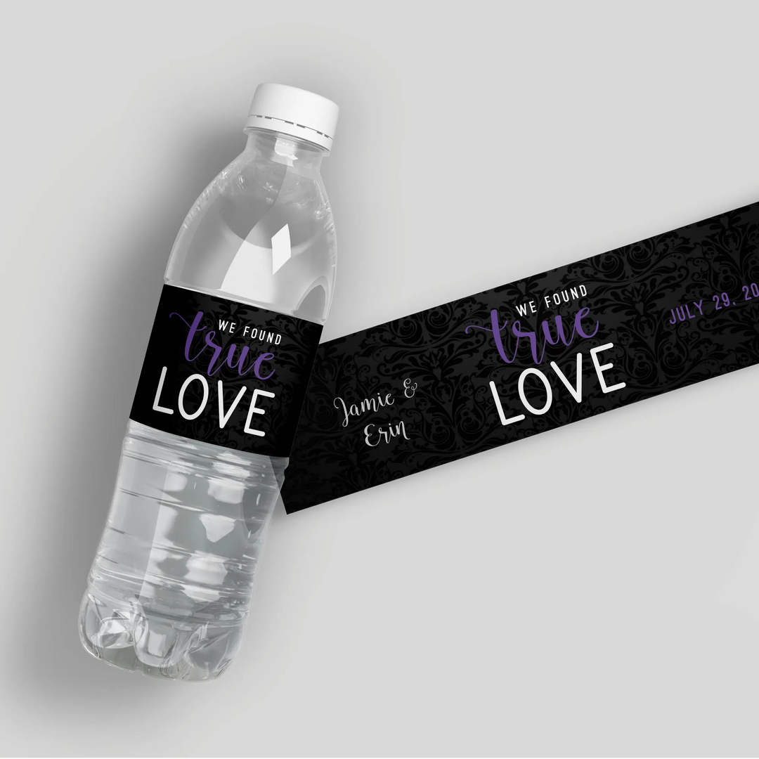 Custom black wedding water bottle label with 'We Found True Love' and floral pattern