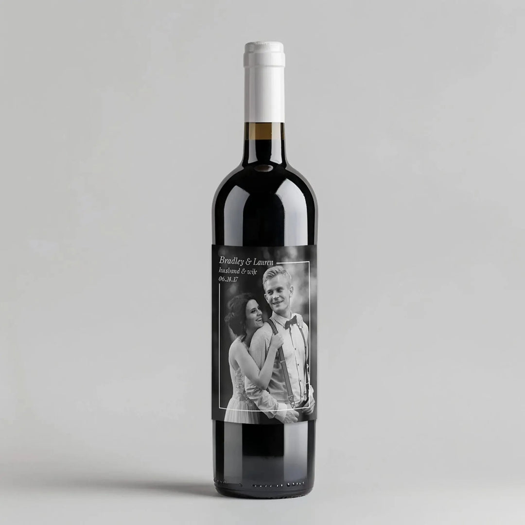 Custom wine bottle with black and white wedding photo label and personalized names