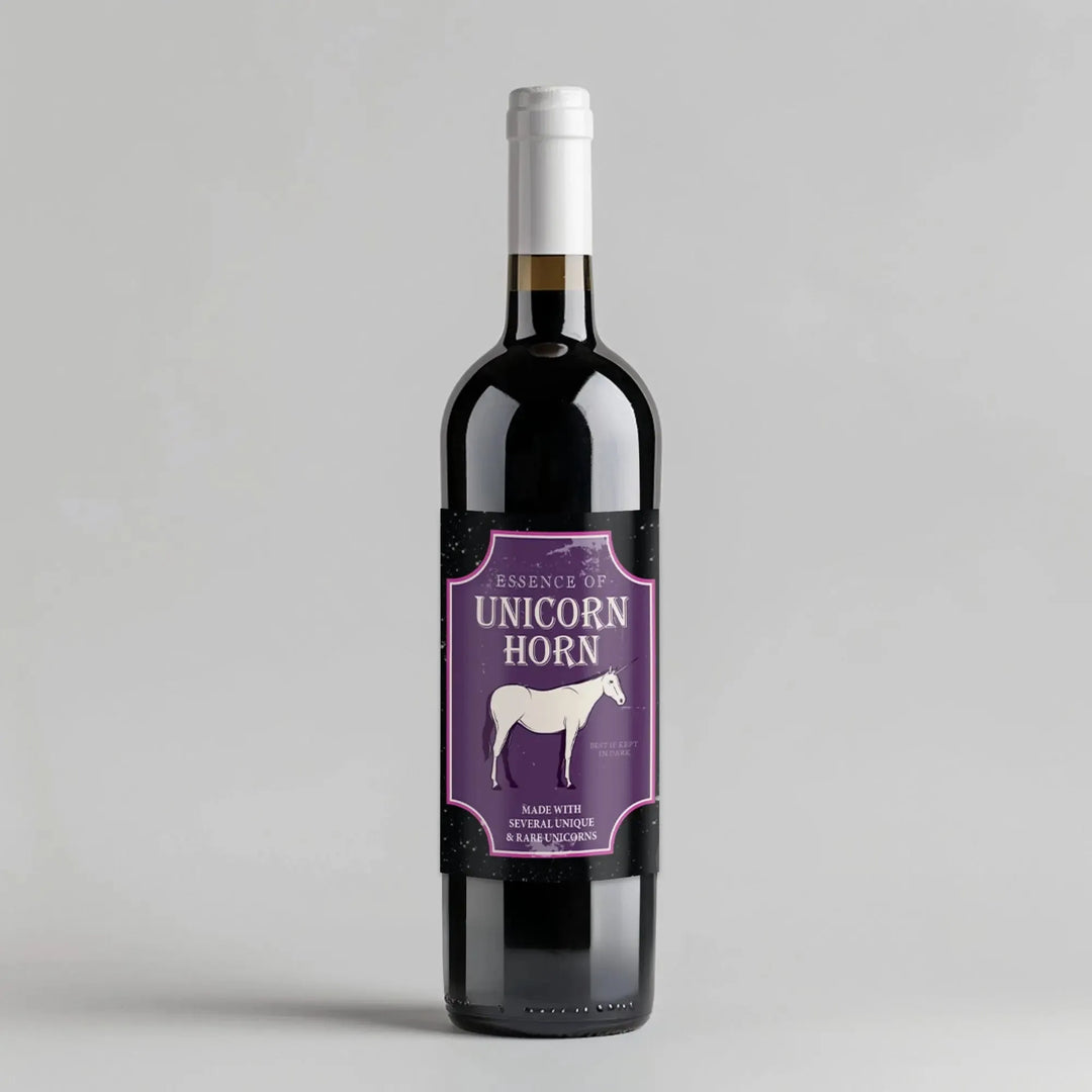 Unicorn wine bottle with purple label featuring white unicorn illustration and text