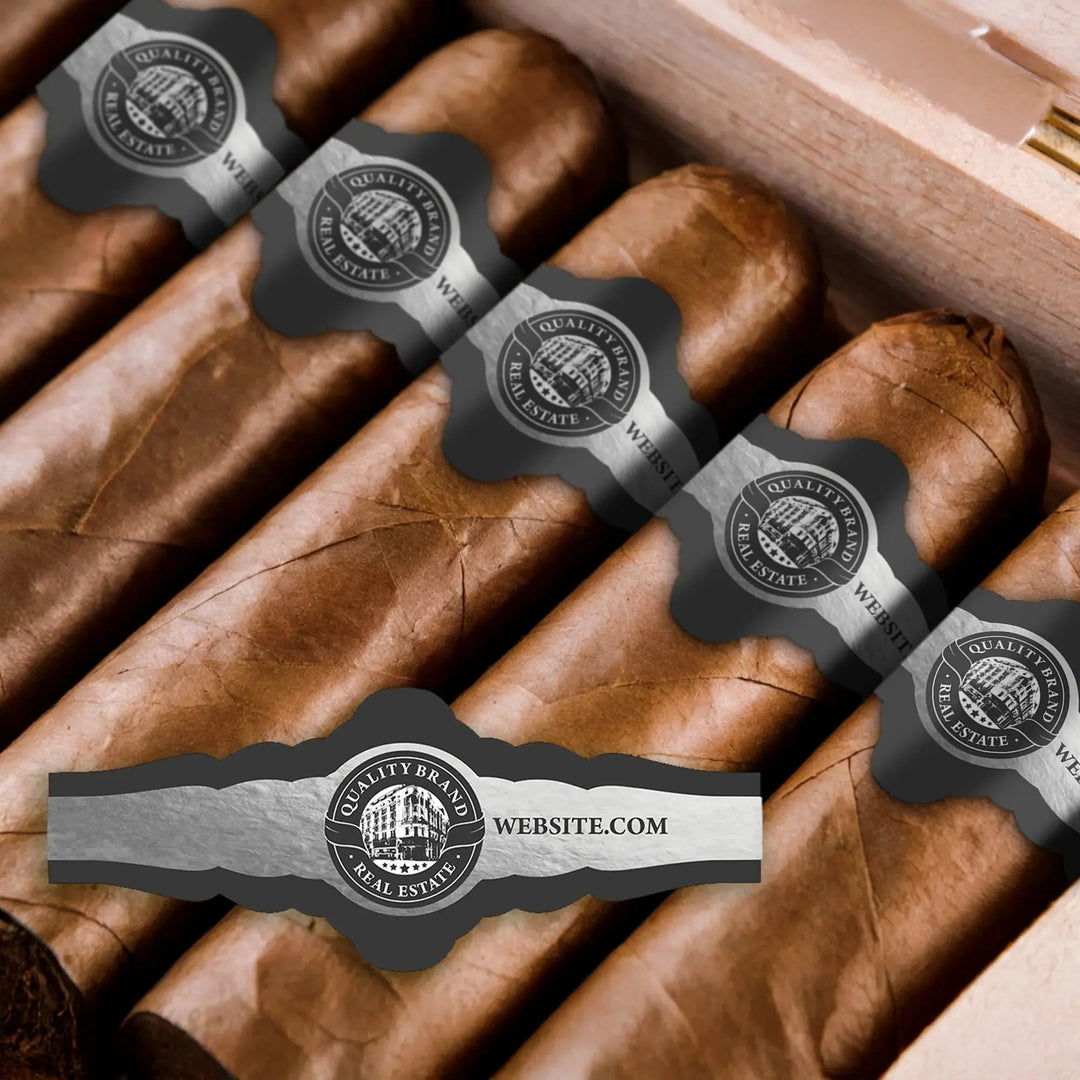 Custom cigar bands with vintage building logo and real estate branding on cigars in a wooden box