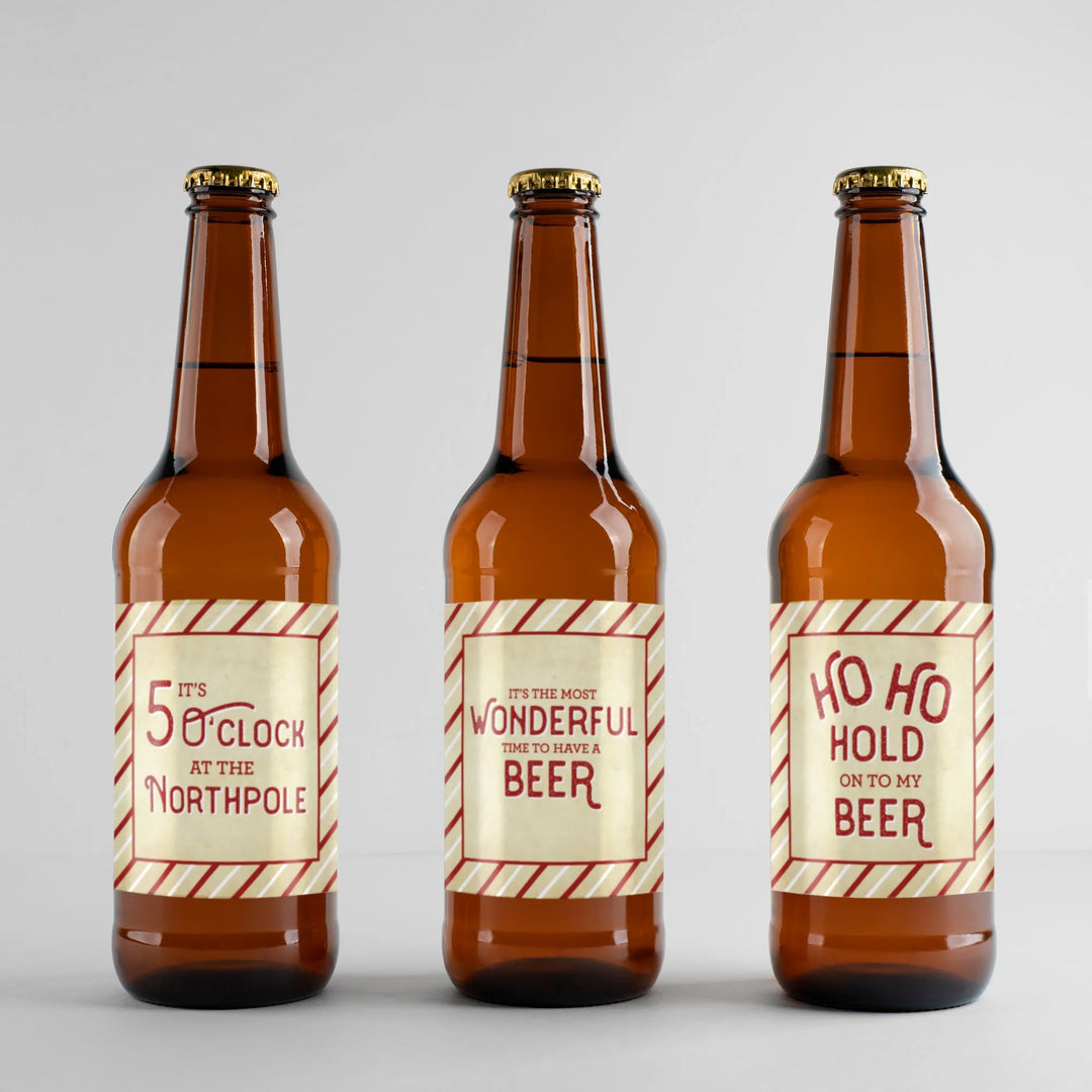 Vintage Christmas beer label set on three brown bottles with festive holiday text designs