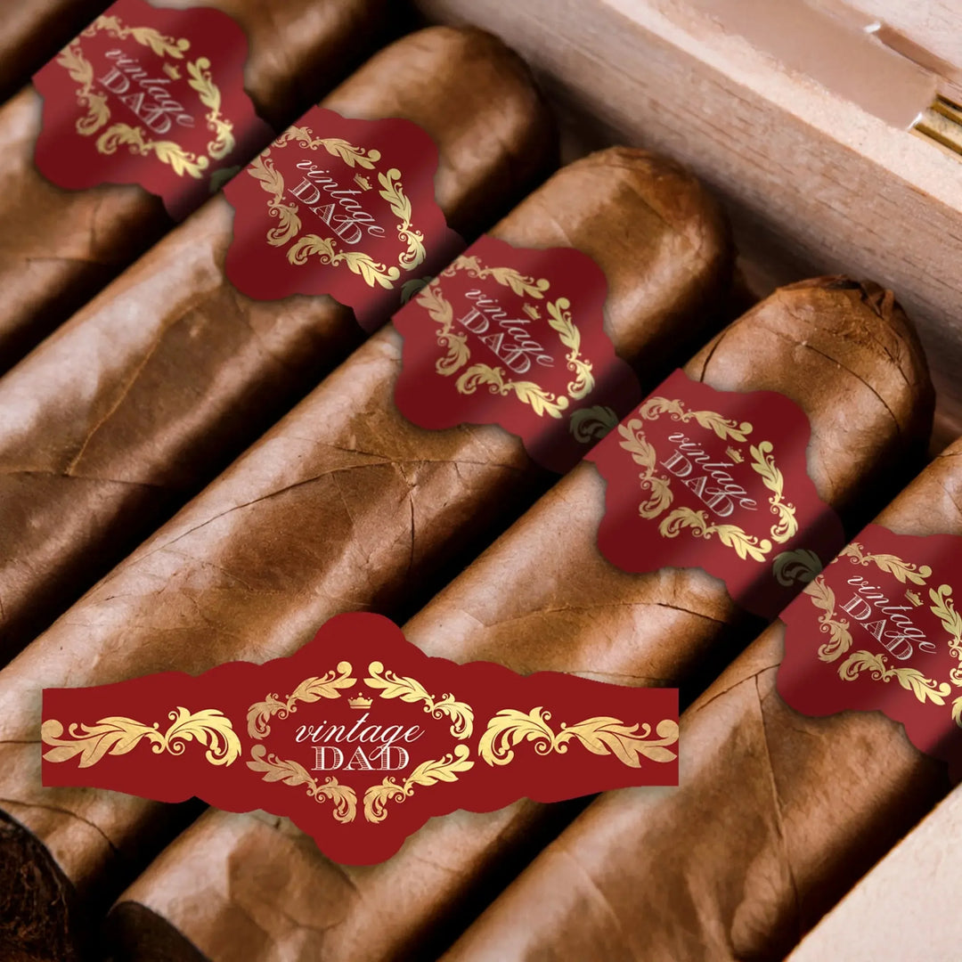 Close-up of cigars in a box with red and gold 'vintage dad' Father's Day cigar bands.