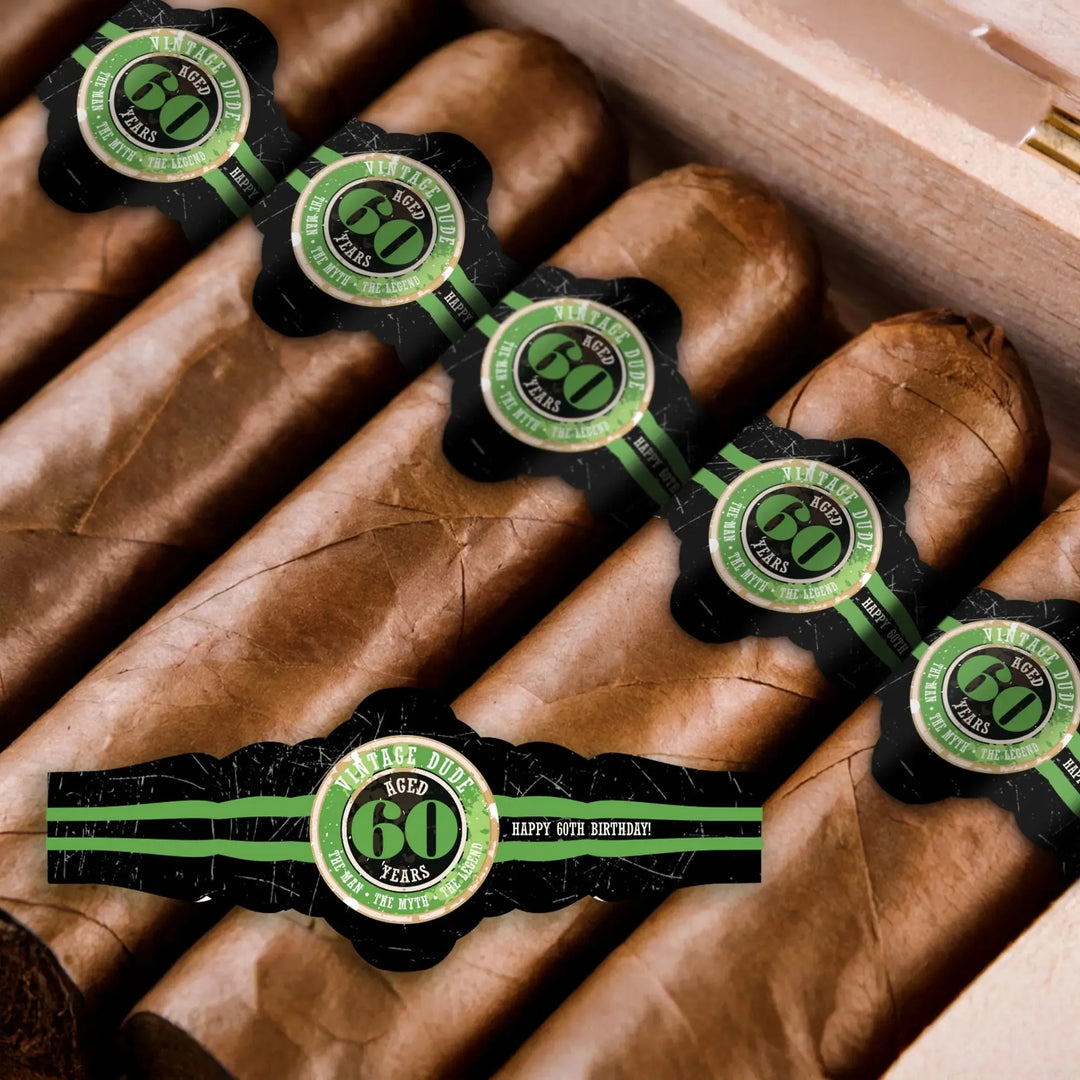 Vintage Dude 60th birthday cigar bands on brown cigars in a wooden box