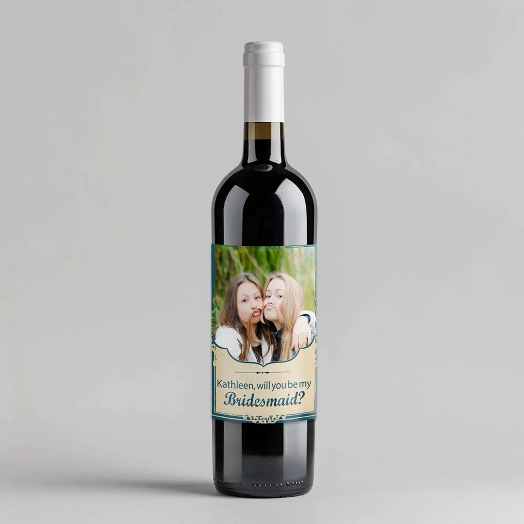 Custom wine bottle with photo label and 'Bridesmaid?' proposal text on a plain background