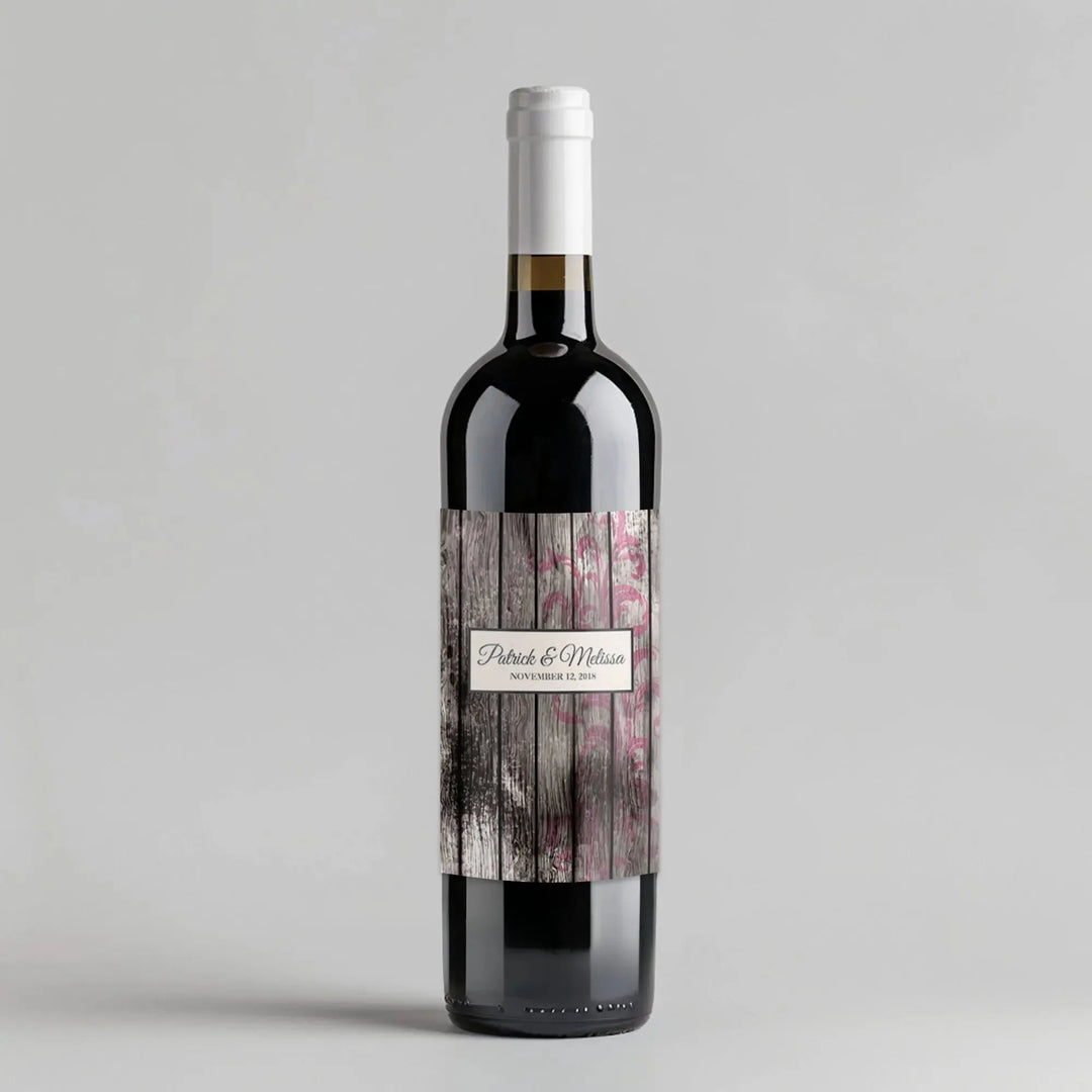 Vintage wood wine label on dark wine bottle with floral accents and personalized text