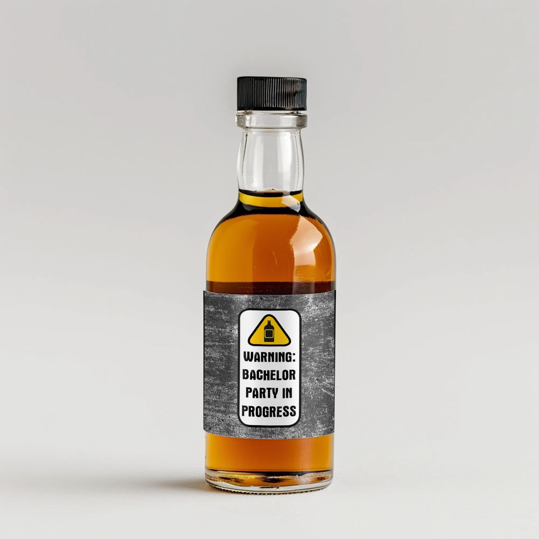Mini liquor bottle with 'Warning: Bachelor Party in Progress' label on gray background