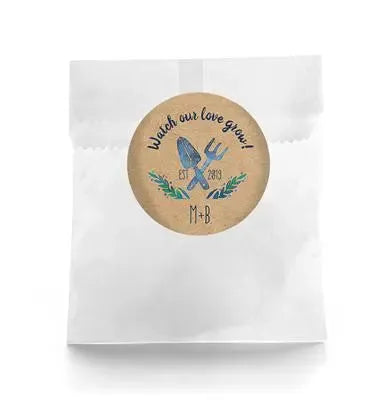 Wedding favor bag with rustic label, garden tools, 'Watch our love grow' text, leaf accents.