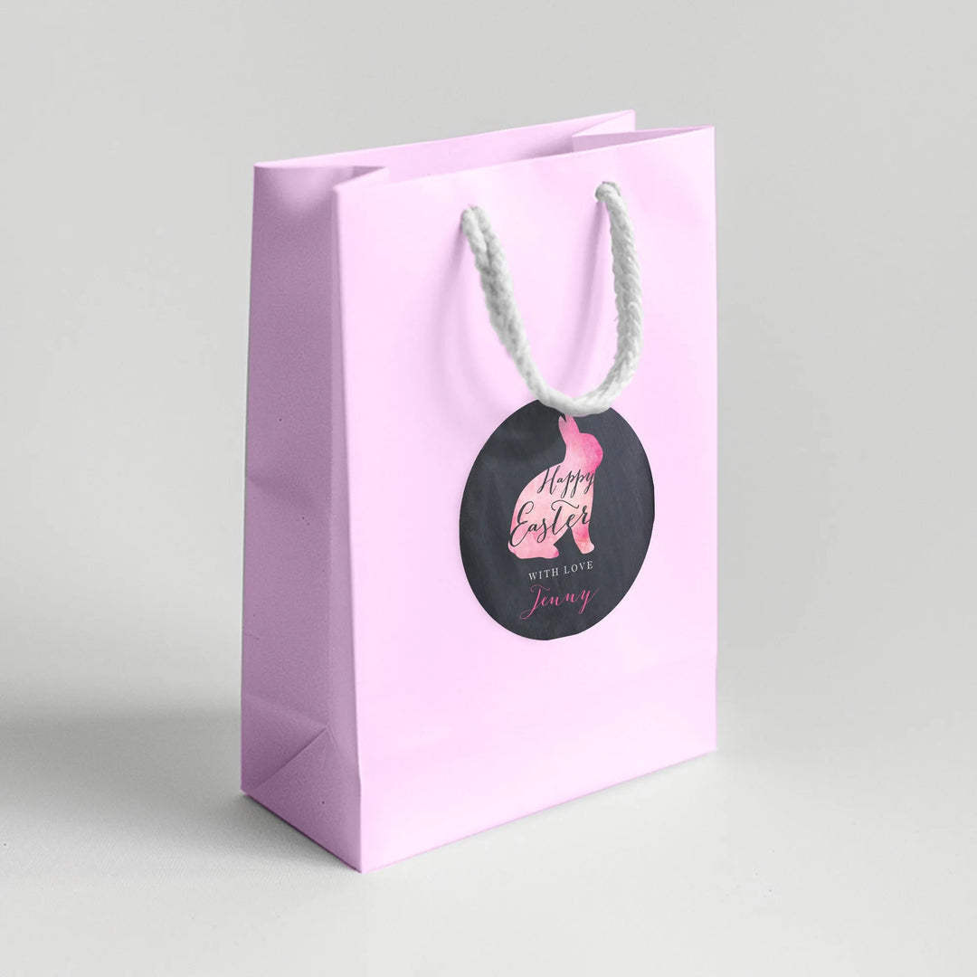 Pink Easter favor bag with watercolor bunny label and white rope handle