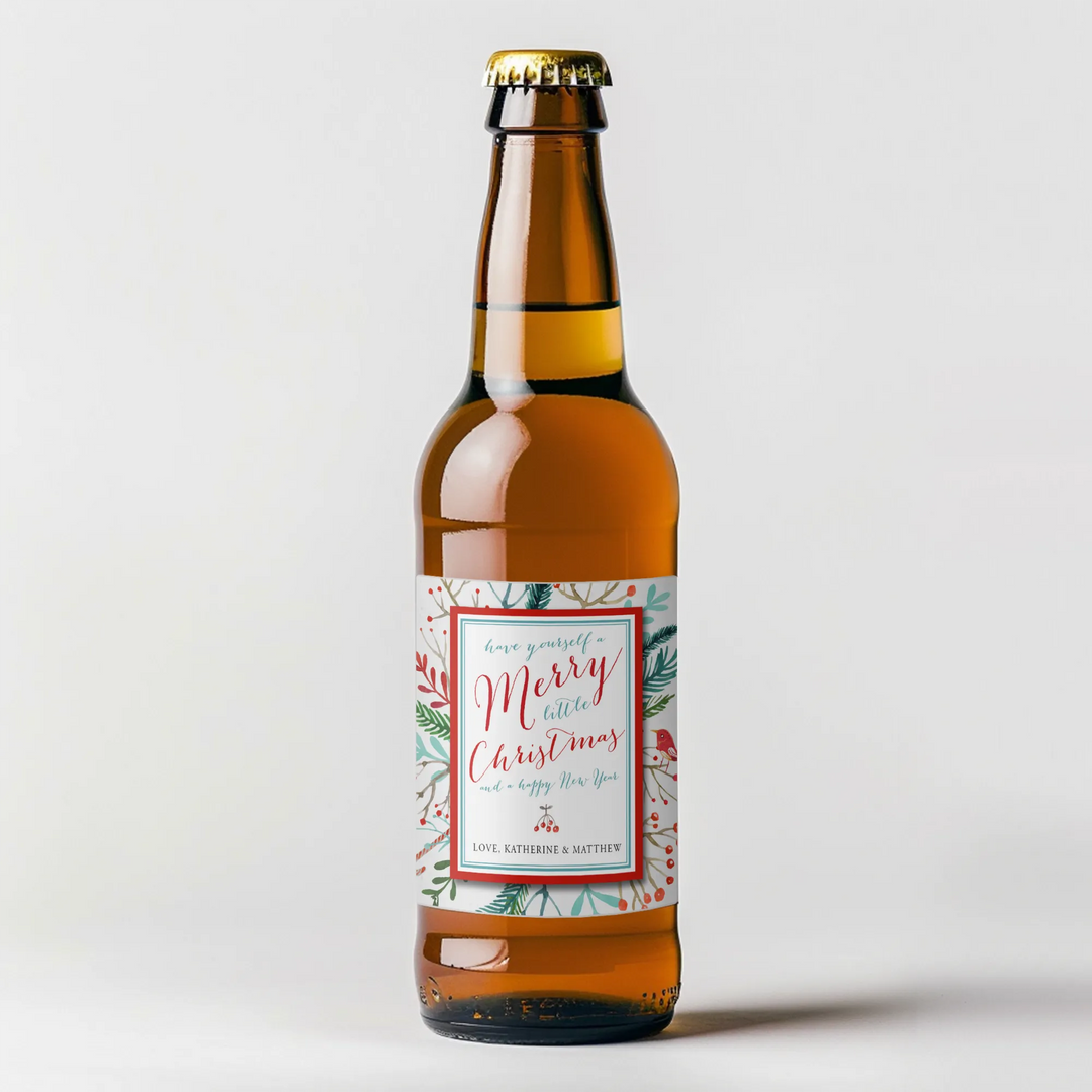 Christmas beer bottle with festive watercolor label and holiday greenery design