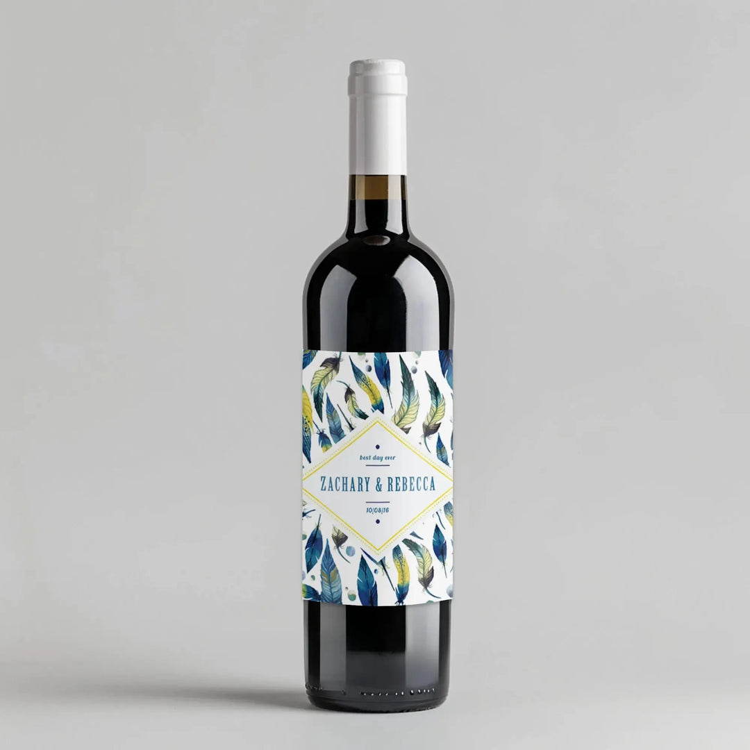 Wine bottle with watercolor feather label and custom names Zachary & Rebecca on white background