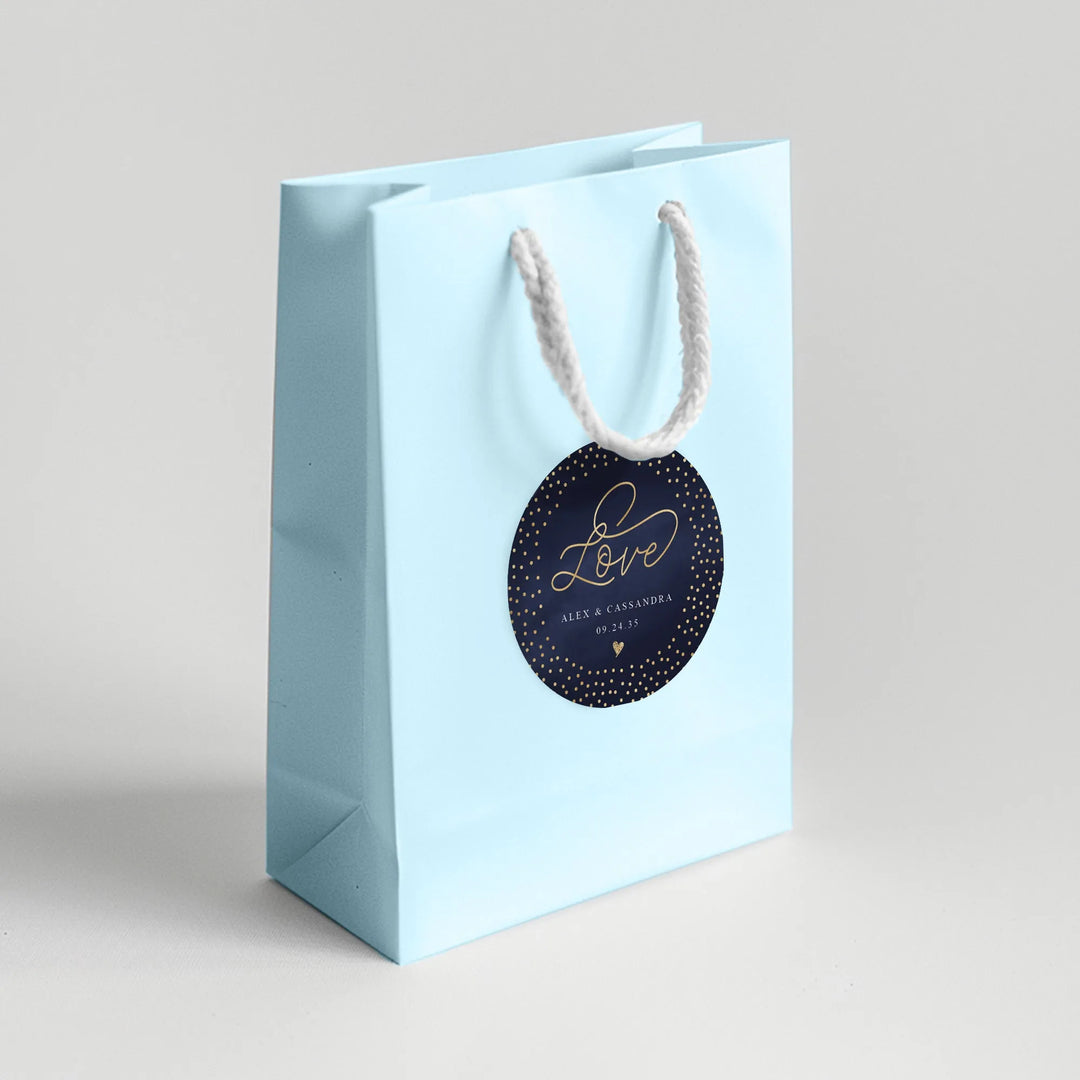 Light blue wedding favor gift bag with dark blue love label and white rope handles