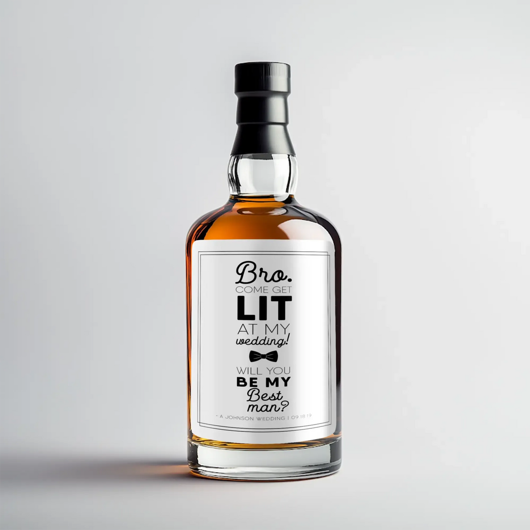 Whiskey bottle with custom 'best man' wedding proposal label on a plain background