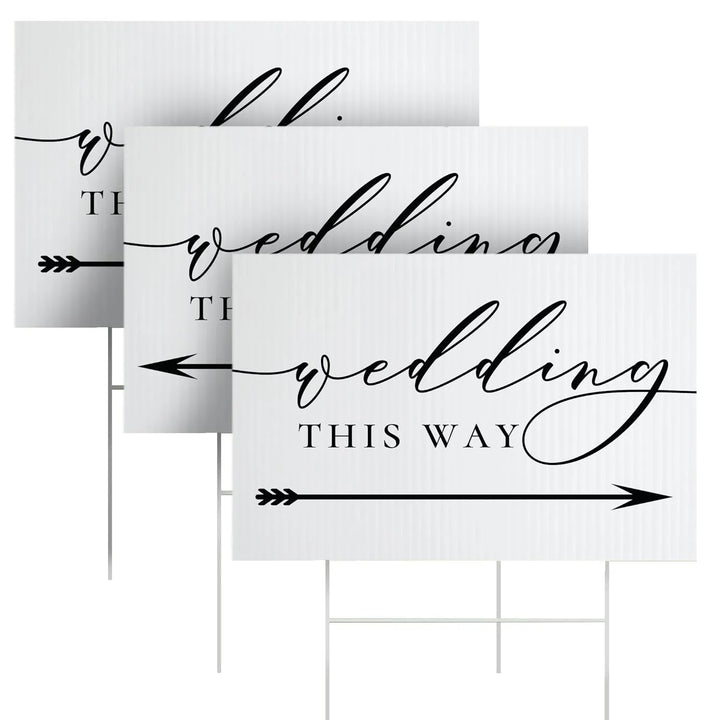 Three white yard signs with black arrow and elegant wedding this way text for wedding directions