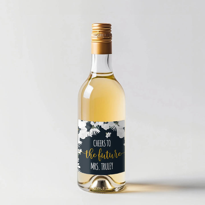White wine bottle with gold cap and floral custom mini label, cheers to the future Mrs. Truley