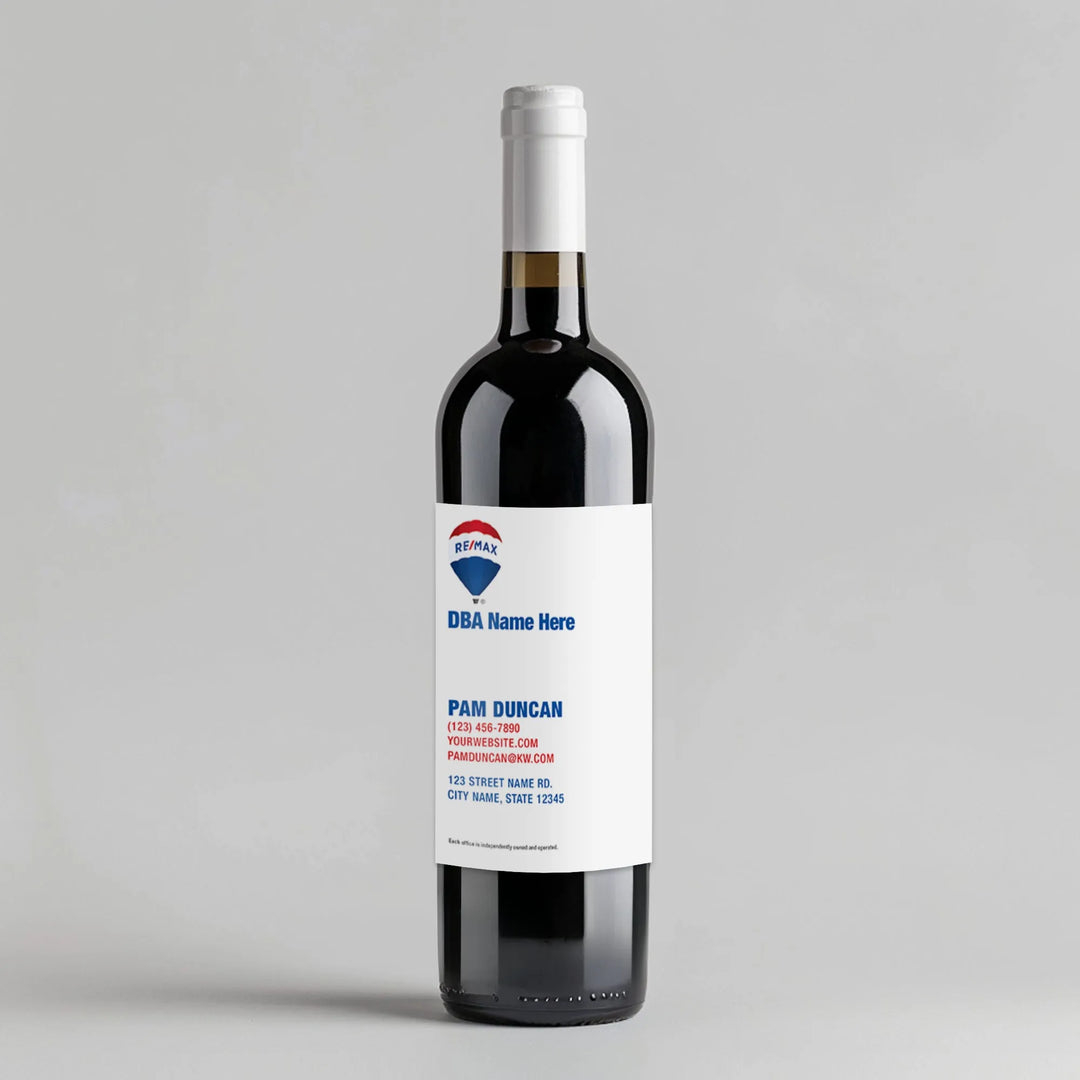 REMAX branded wine bottle with custom white label, contact info, on gray background