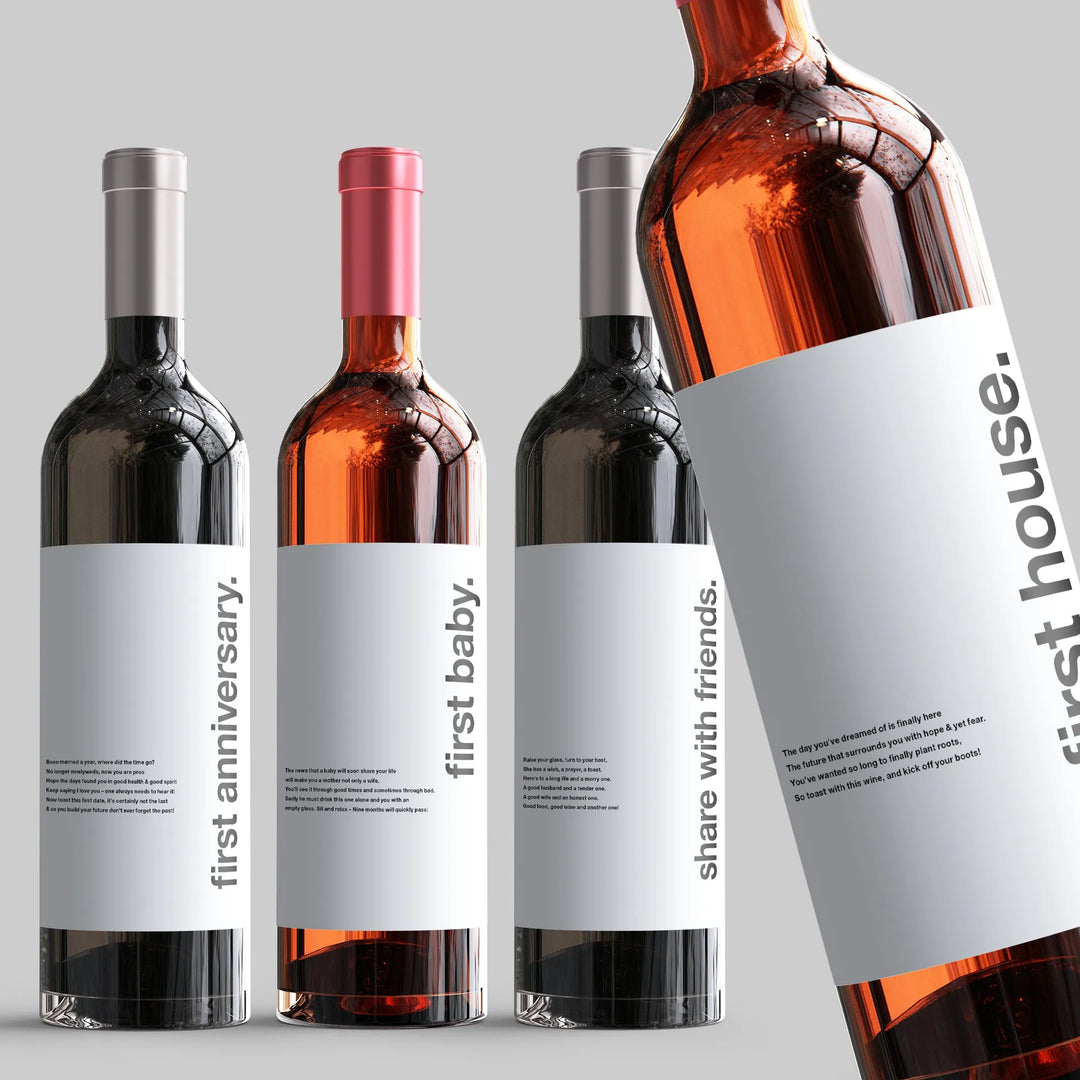 Milestone wine bottles with modern white labels for first anniversary, first baby, friends, first house