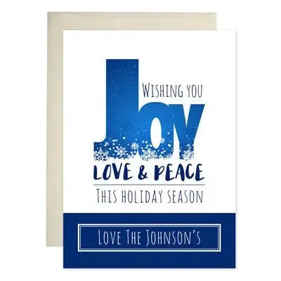 Blue and white holiday card with 'Wishing you Joy Love & Peace this holiday season' text.