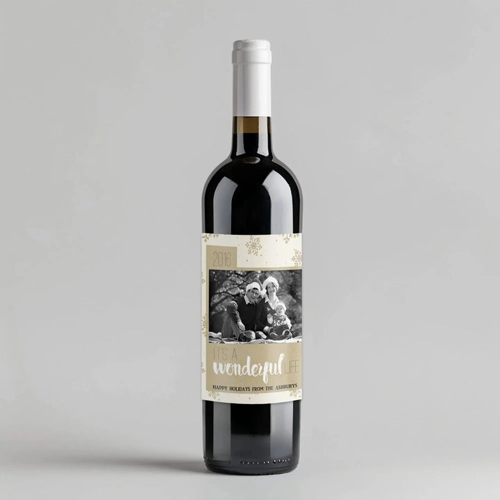 Custom holiday wine bottle with It's a Wonderful Life label, family photo, and gold snowflakes