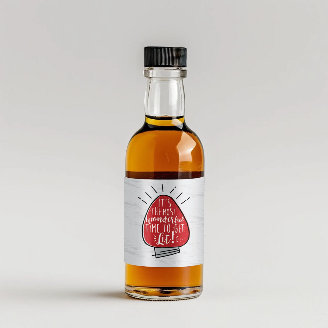 Mini liquor bottle with festive 'It's the most wonderful time to get lit!' label