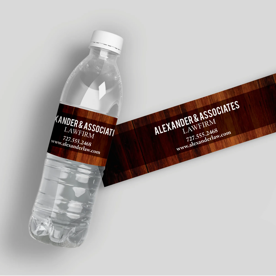 Law firm water bottle with custom wood grain label displaying Alexander & Associates details