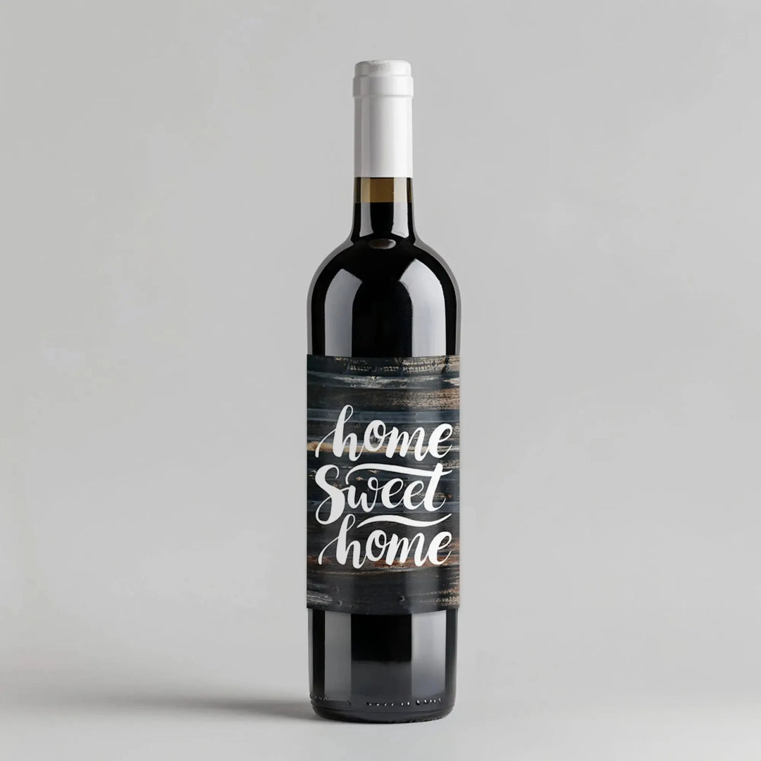 Wine bottle with custom wood-style label reading 'home sweet home' on gray background