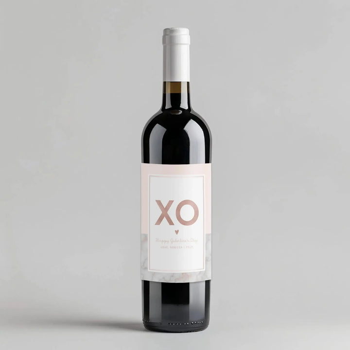 Galentine's Day wine bottle with XO label on light grey background